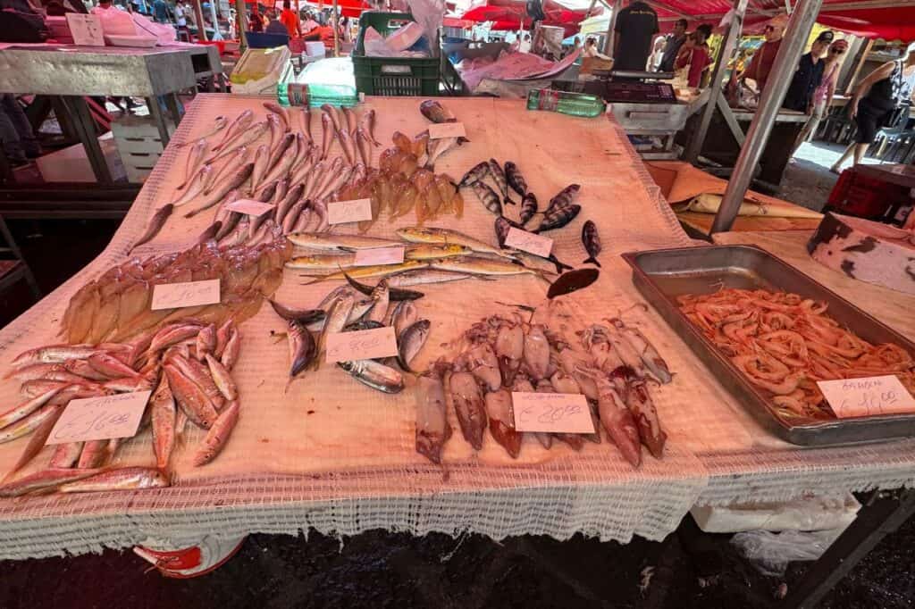 Discover the bustling fish market in Catania where locals shop for fresh seafood daily.