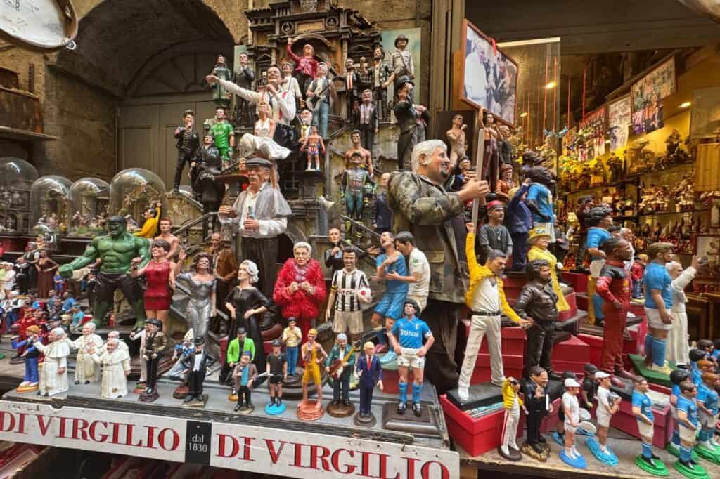Colorful handcrafted figurines displayed in a shop on Via San Gregorio Armeno
