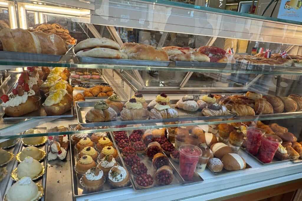Freshly baked sfogliatella pastries filled with ricotta and other treats at a Naples bakery