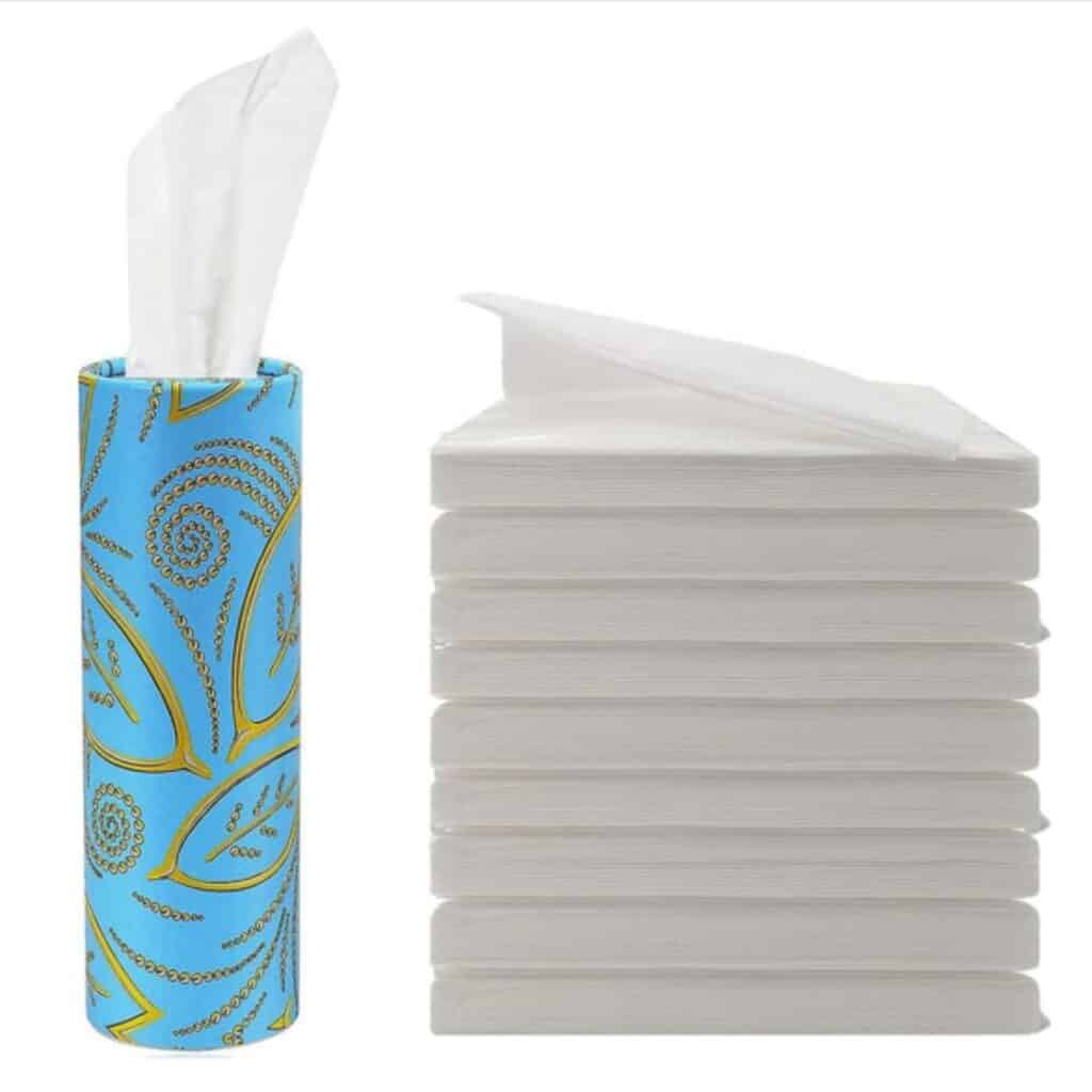 Compact tube-style travel tissue container with additional refill tissue packs